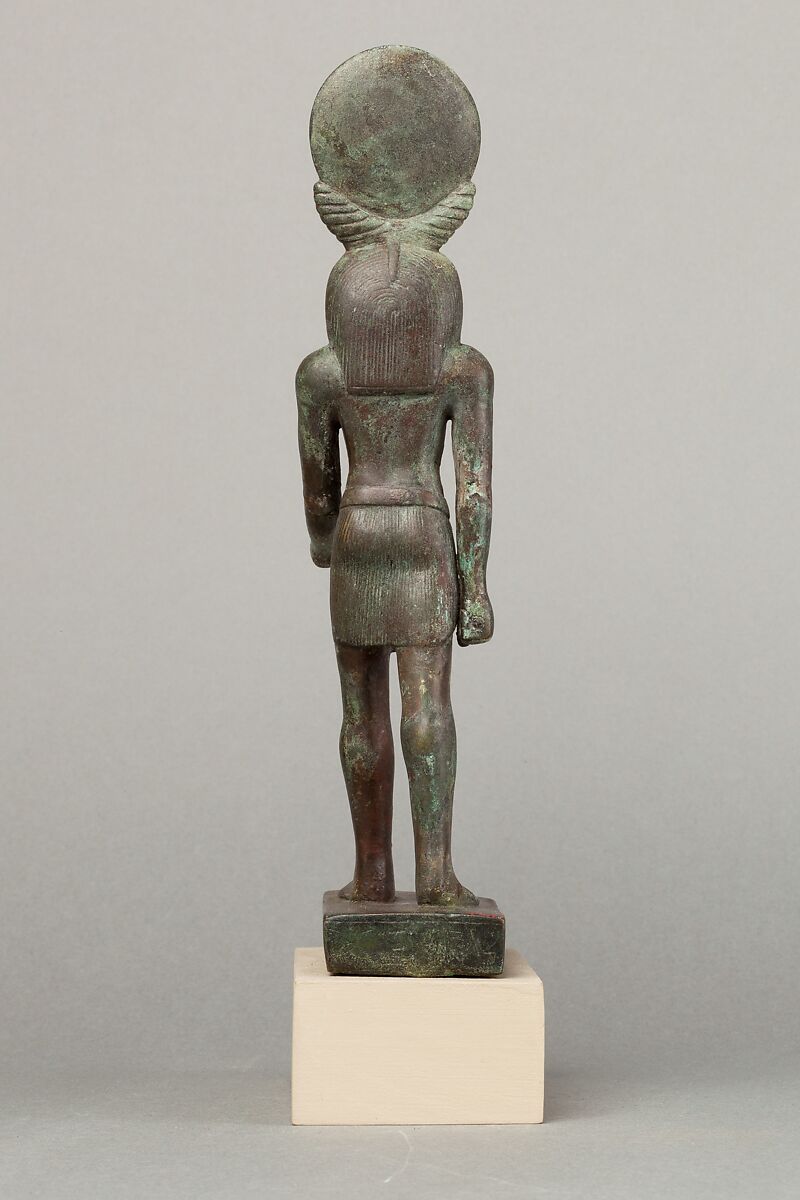 An ancient base asking blessings from Heka for the Scribe of the Library of Atum Pa-kap, son of the Prophet of Atum Pa-iry-kap and the mistress of the House Hr-ib-Wadjet; statue modern above the ankles, Bronze, brass, precious metal inlay