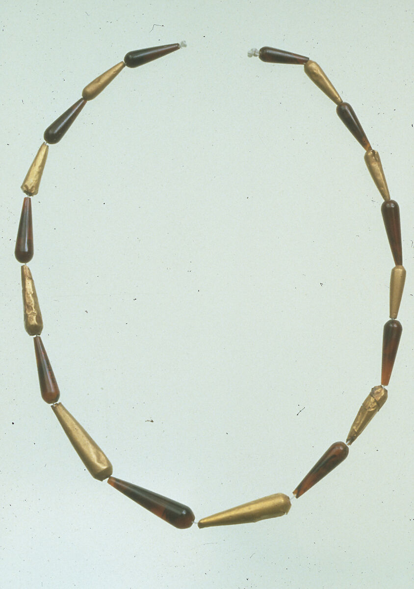Nineteen Drop Beads here Strung as a Necklace, Gold, sard
