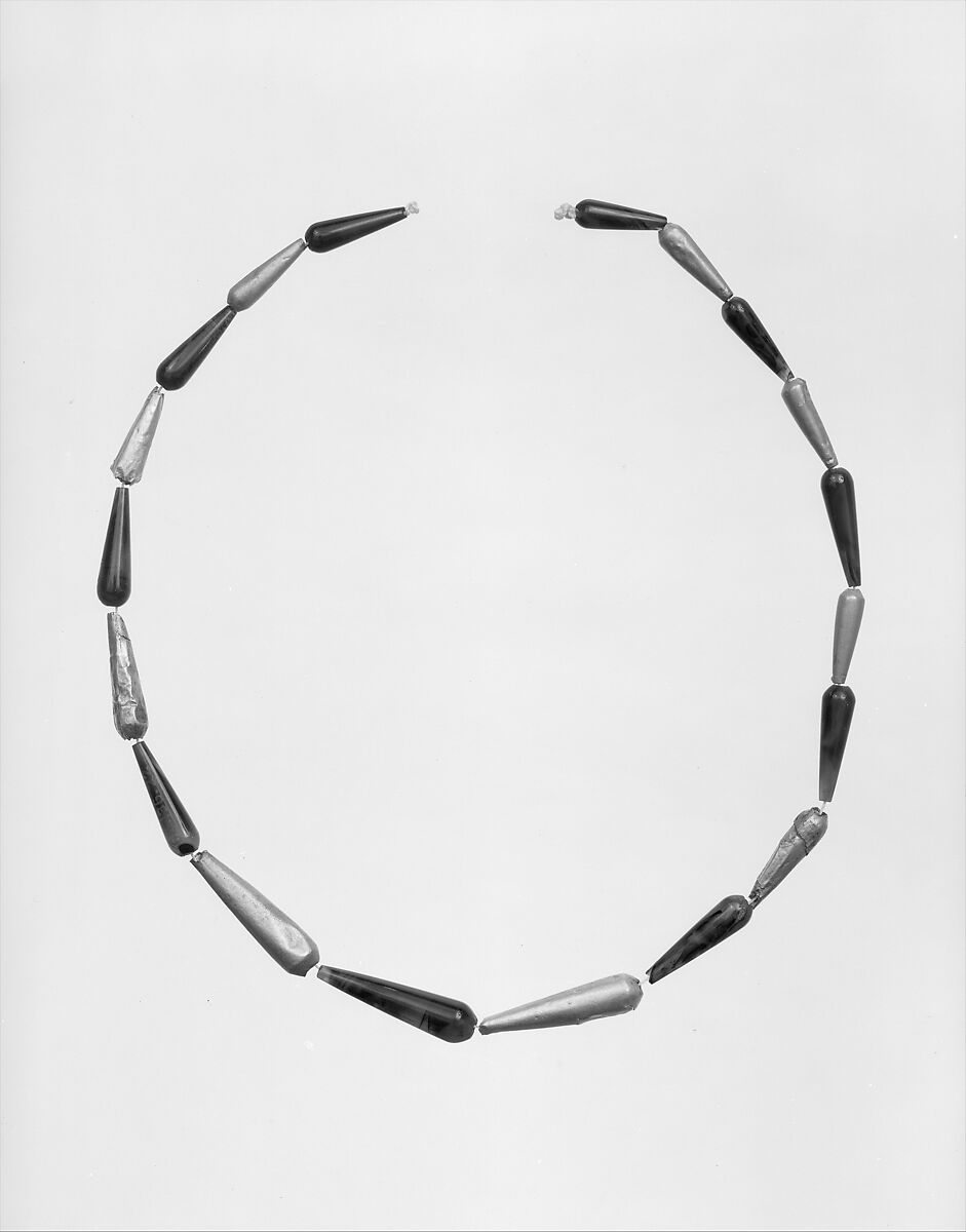 Nineteen Drop Beads here Strung as a Necklace, Gold, sard