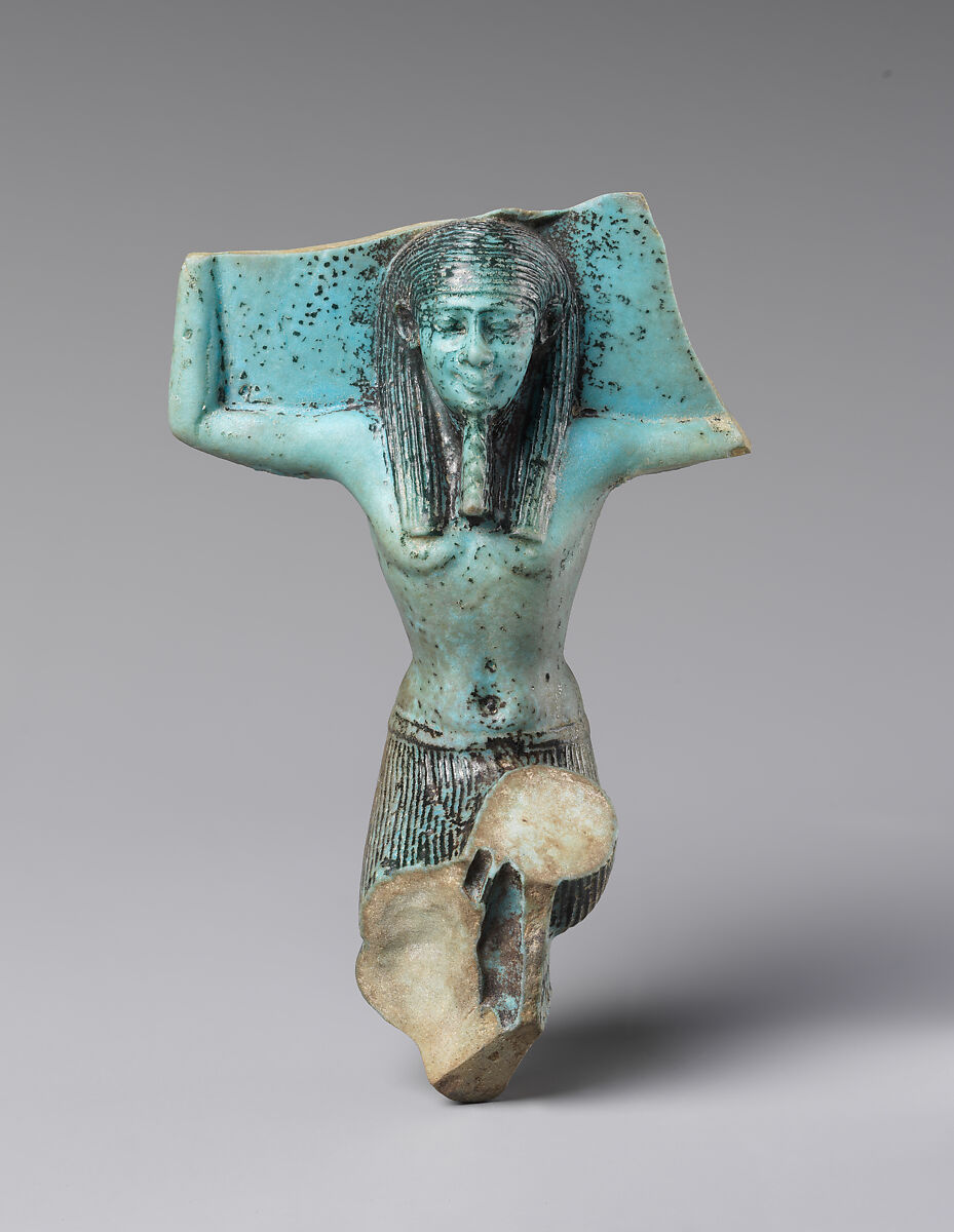 Figurine of a kneeling god, probably Shu, faience