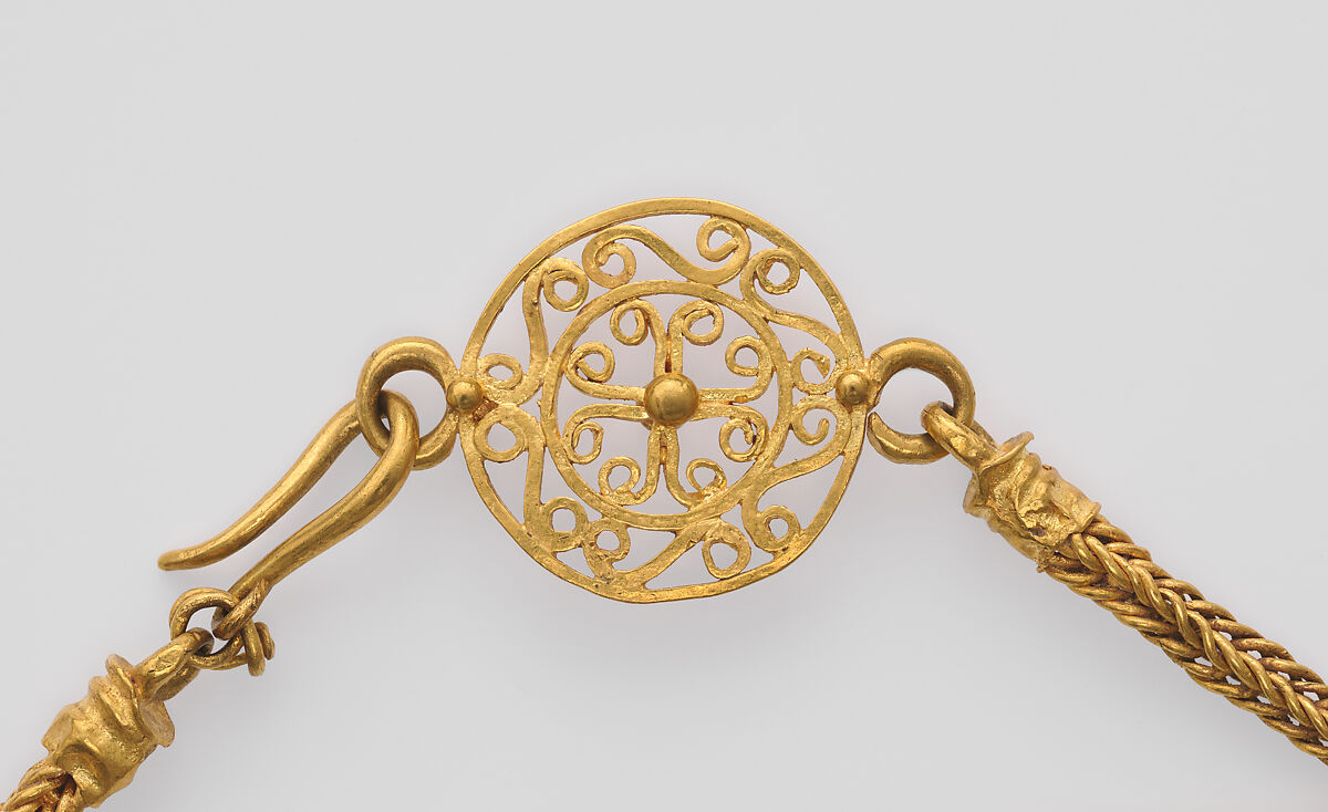 Loop-in-loop chain with intricate openwork medallion at the clasp and a gold Bes pendant, Gold