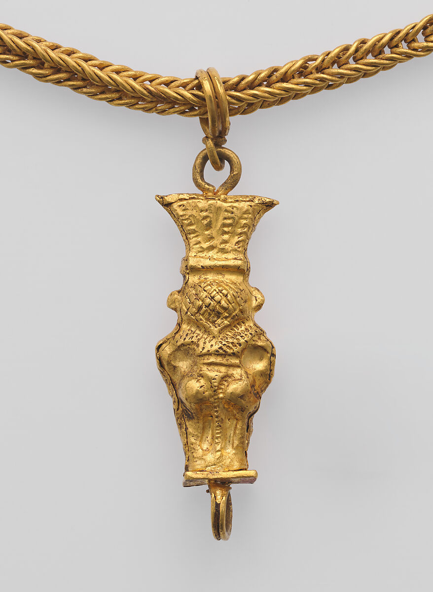 Loop-in-loop chain with intricate openwork medallion at the clasp and a gold Bes pendant, Gold