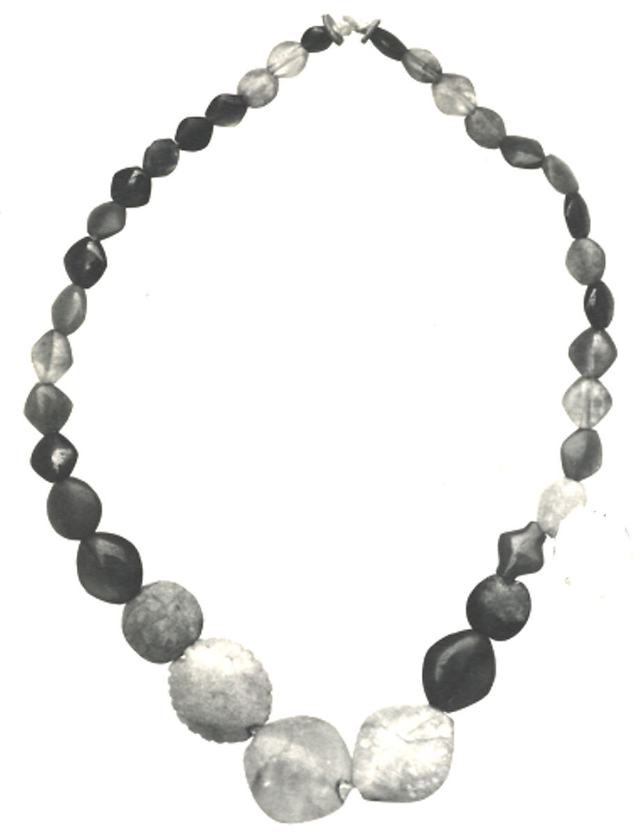 String of beads, Carnelian, garnet, green feldspar, amethyst, green jasper, black and white mottled stone