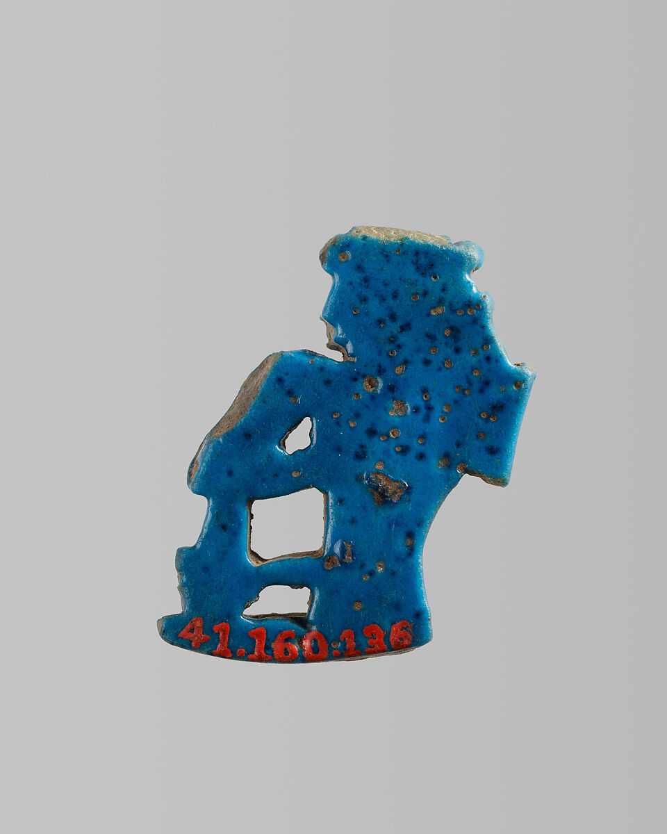 Amulet of seated goddess / queen with ankh and flail, Blue faience