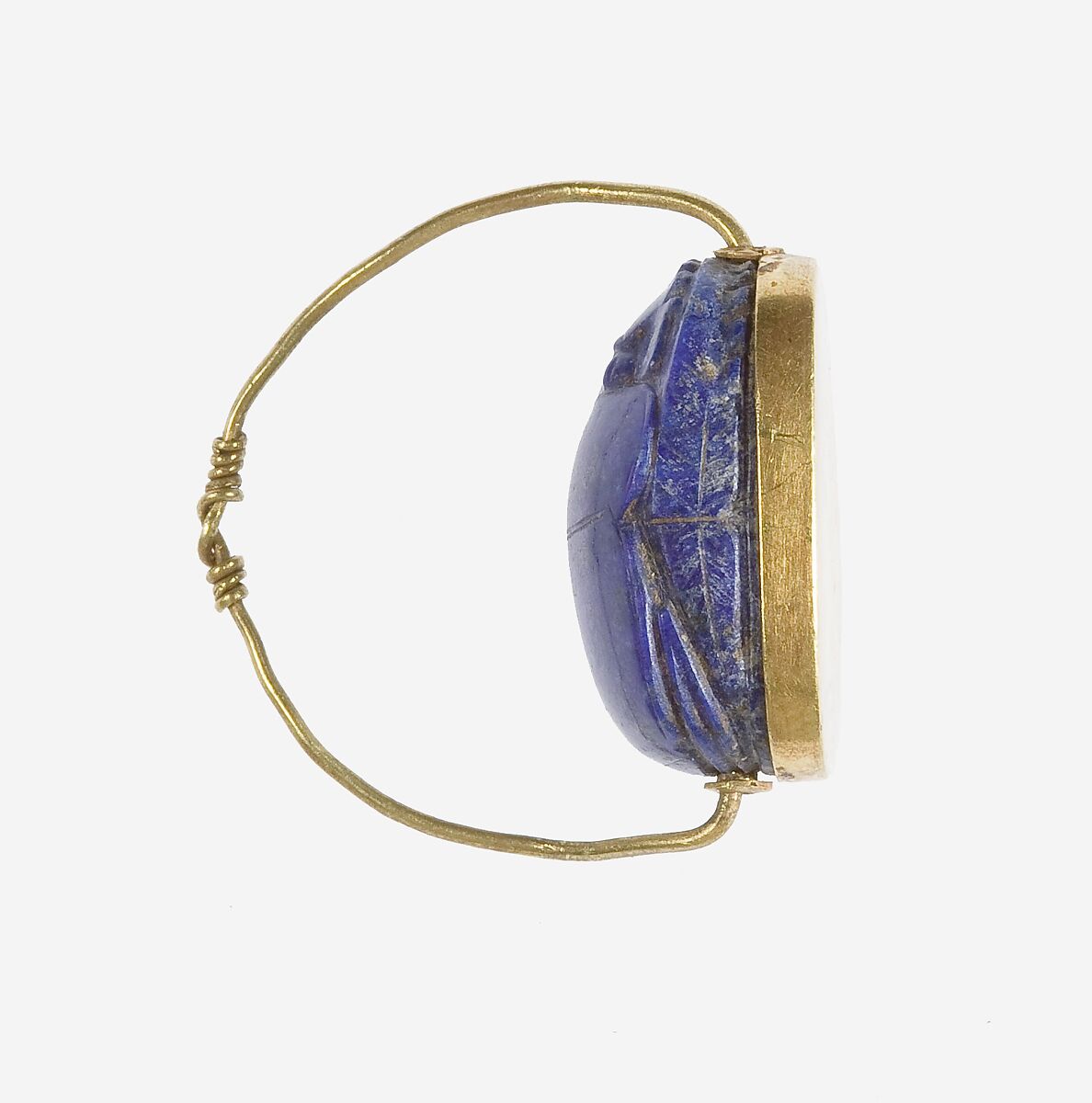 Scarab Finger Ring, Lapis lazuli scarab set in gold plate and on a gold wire ring
Lapis-lazuli