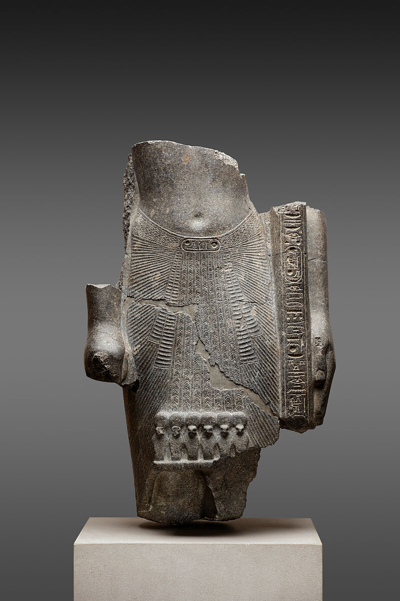 Fragmentary statue of Ramesses II as a standard bearer, Granodiorite 