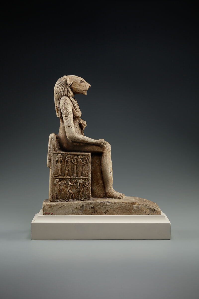 Bastet on a throne decorated with the decans, Faience