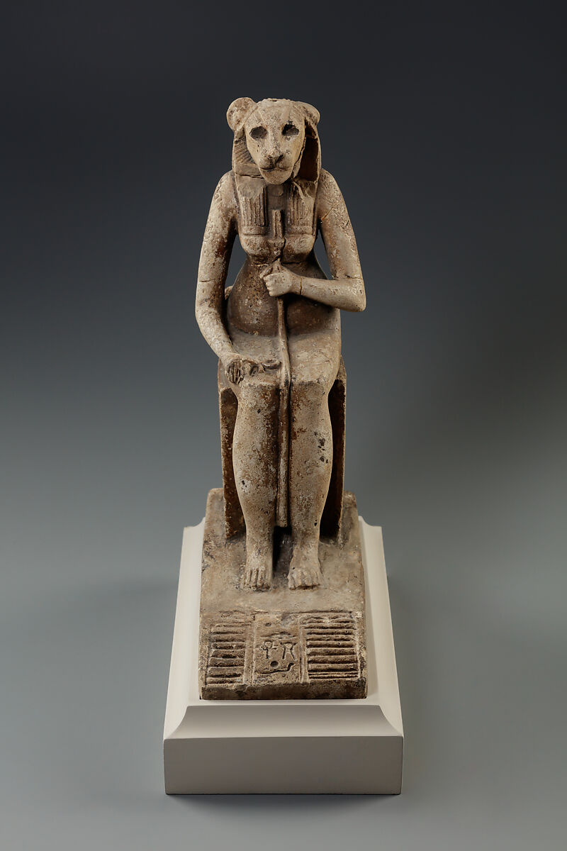 Bastet on a throne decorated with the decans, Faience