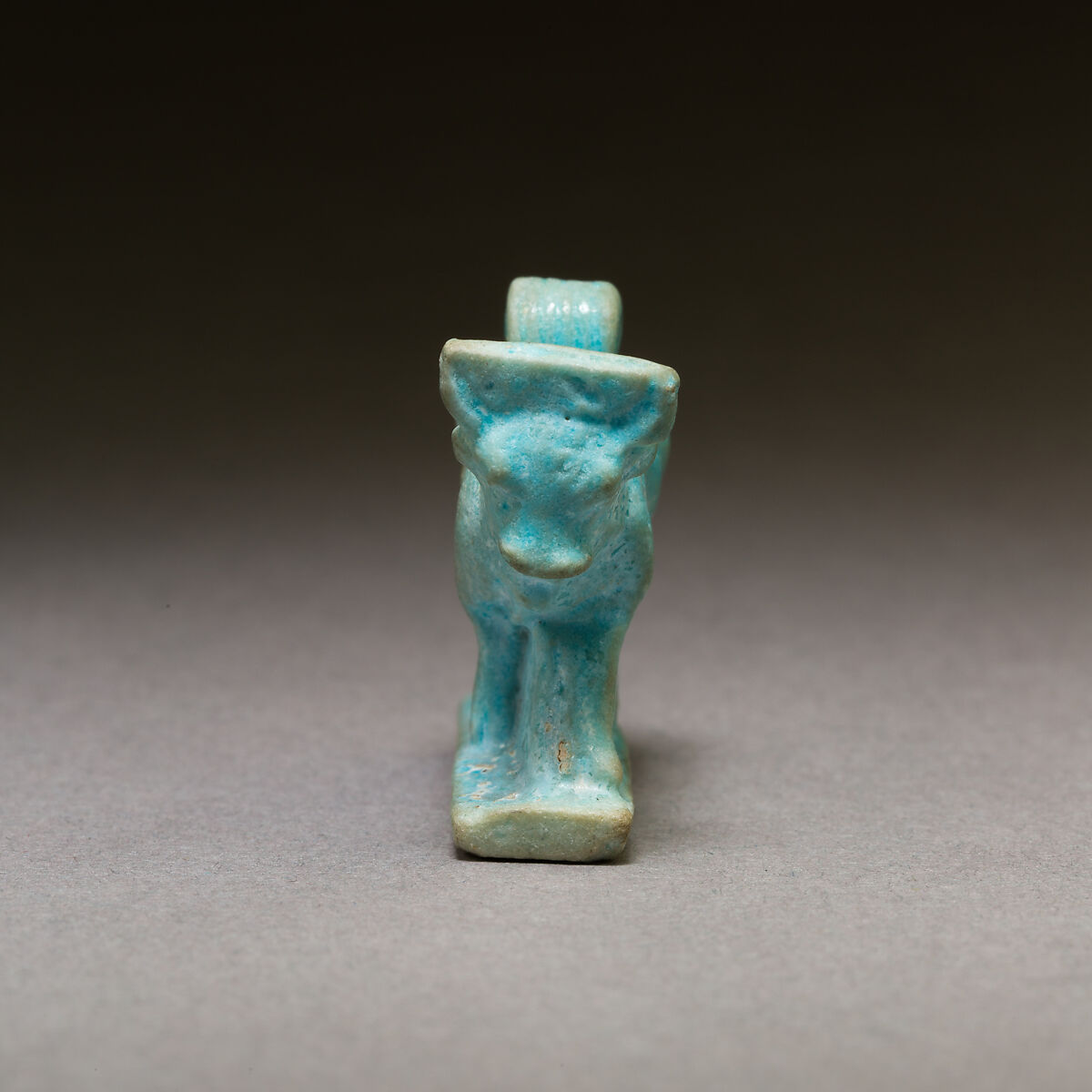 Bull amulet, Pale blue faience