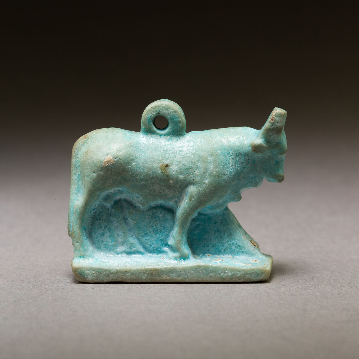 Bull amulet, Pale blue faience 