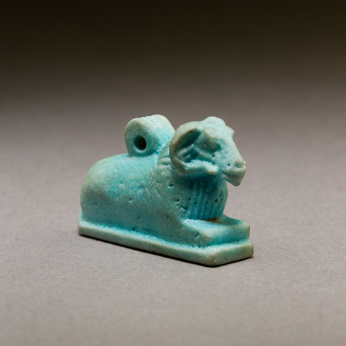 Ram amulet, Pale blue faience 