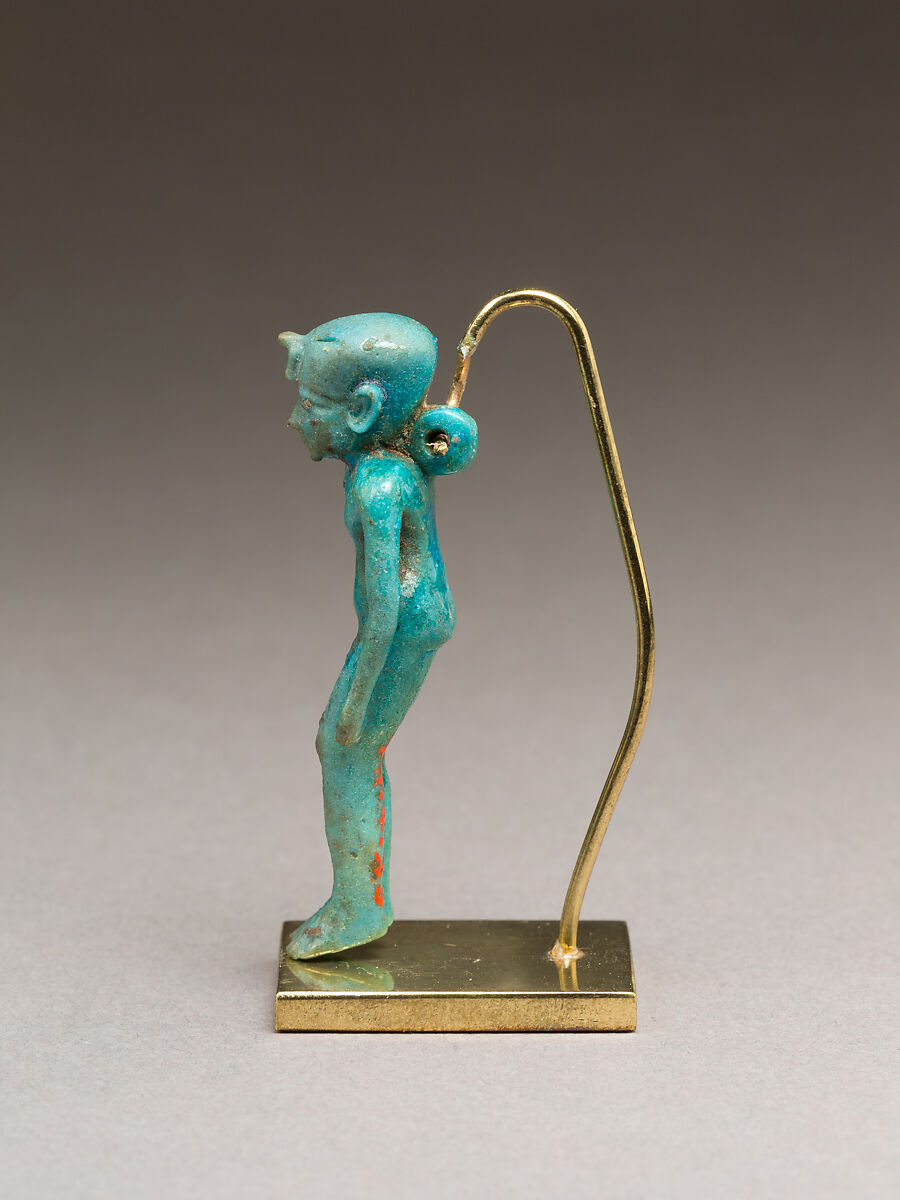 Child god (Harpokrates?) amulet, Faience