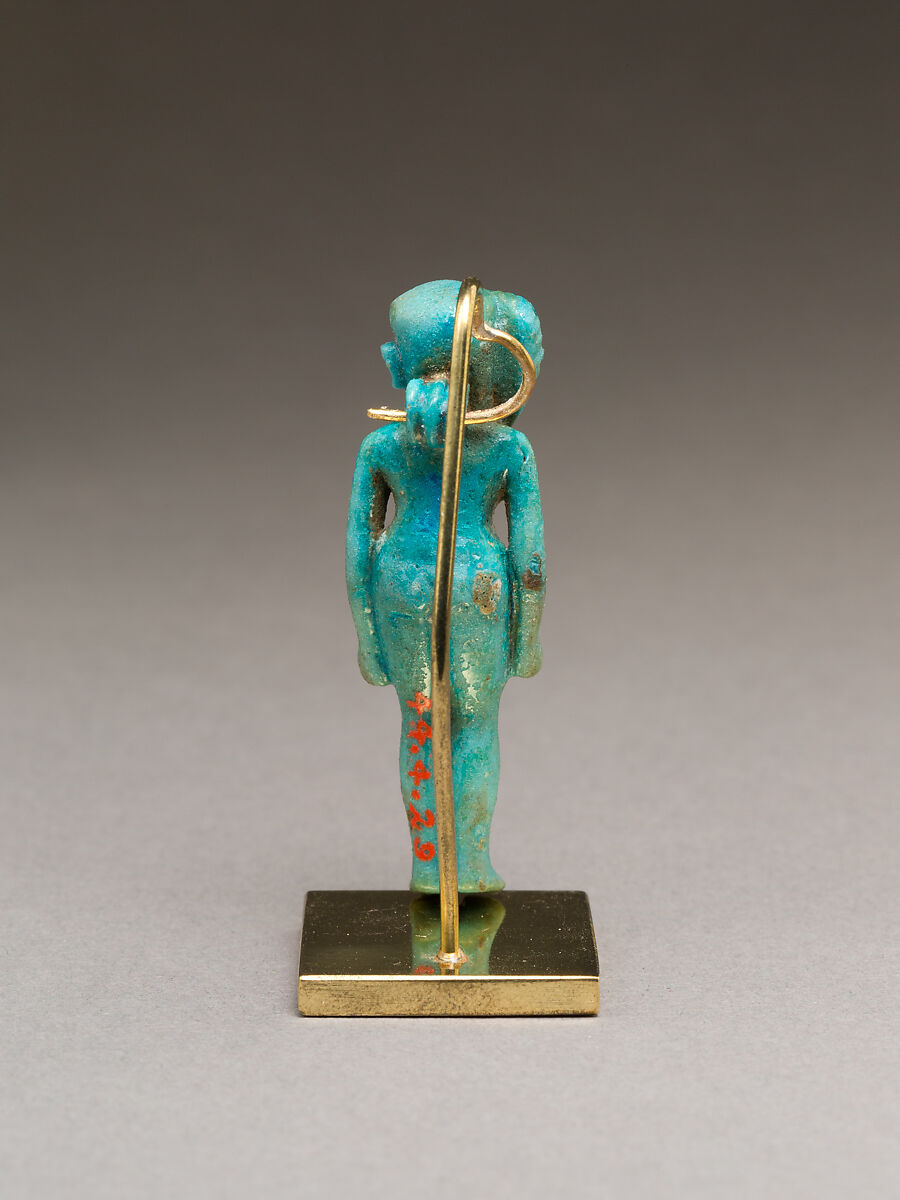 Child god (Harpokrates?) amulet, Faience