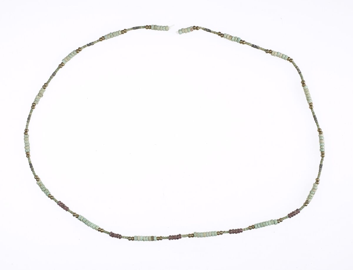 Hepy, String of beads, Faience, paste, garnet, restored bronze 