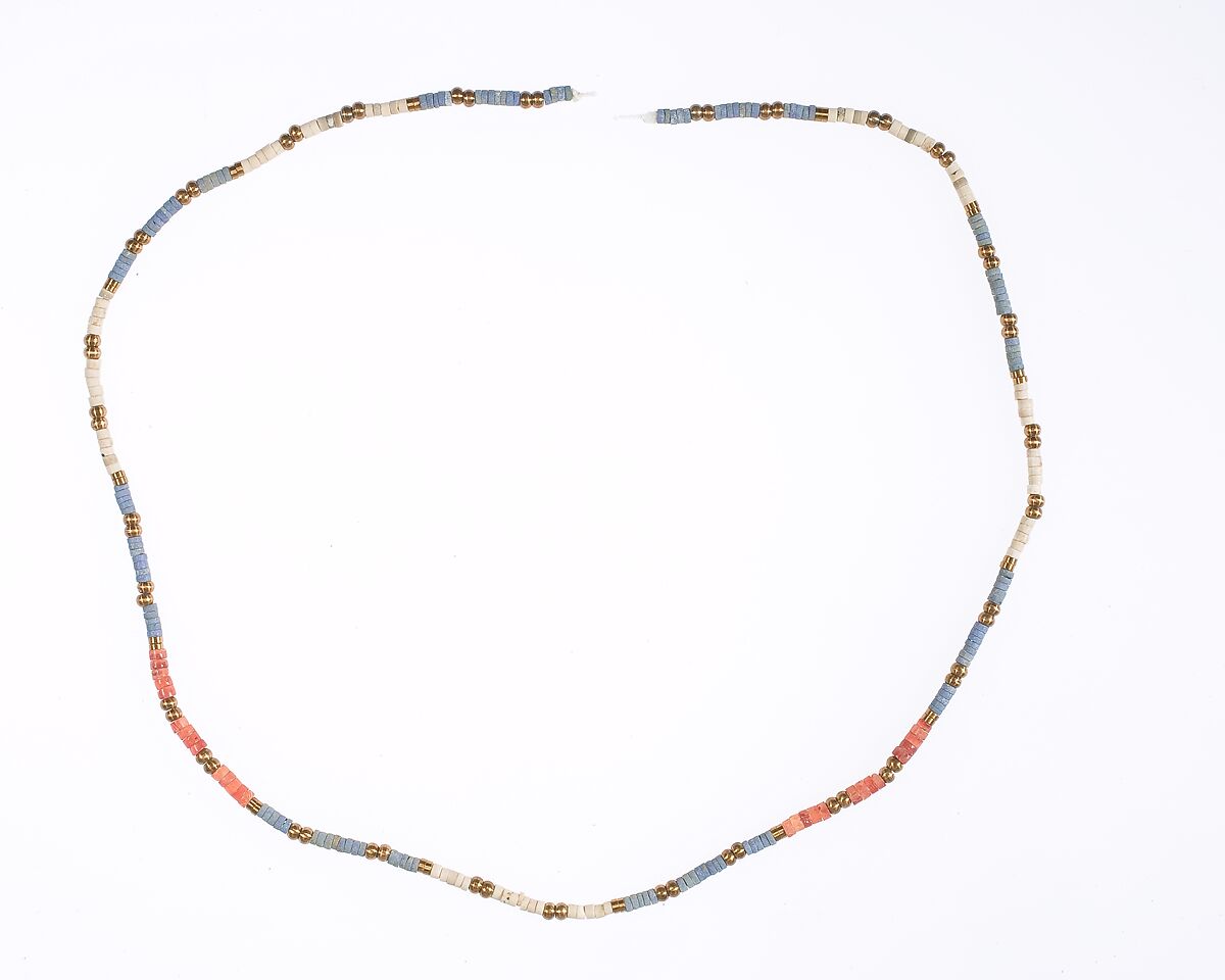 String of ring and ball beads of Hepy, Carnelian, paste, white stone, restored bronze