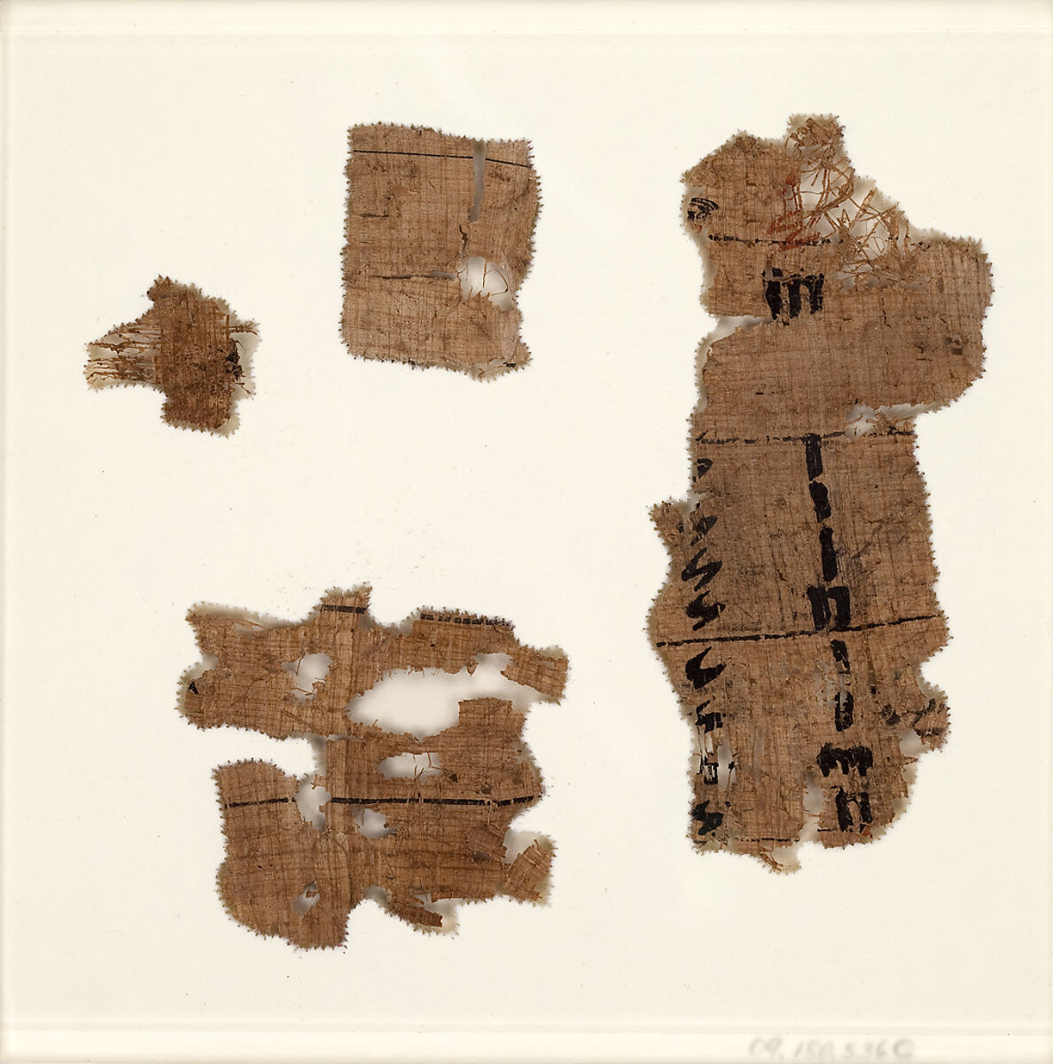 Three frames with papyrus fragments, Papyrus, ink