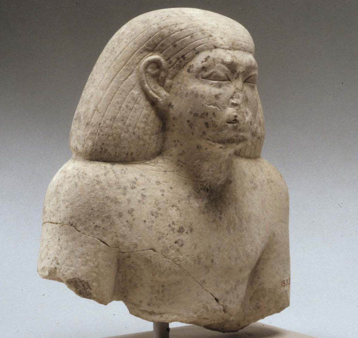 Upper part of male statue, Limestone