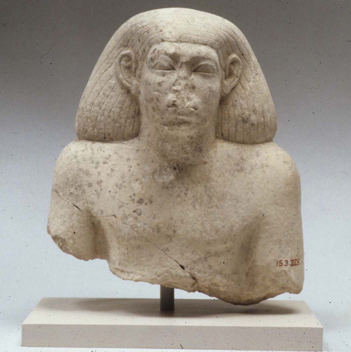 Upper part of male statue, Limestone 