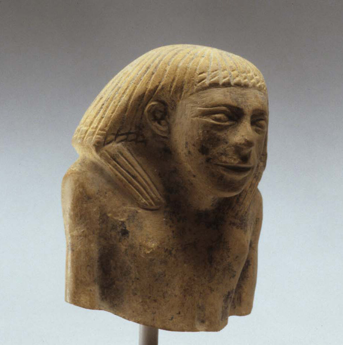 Upper part of male statue, Limestone