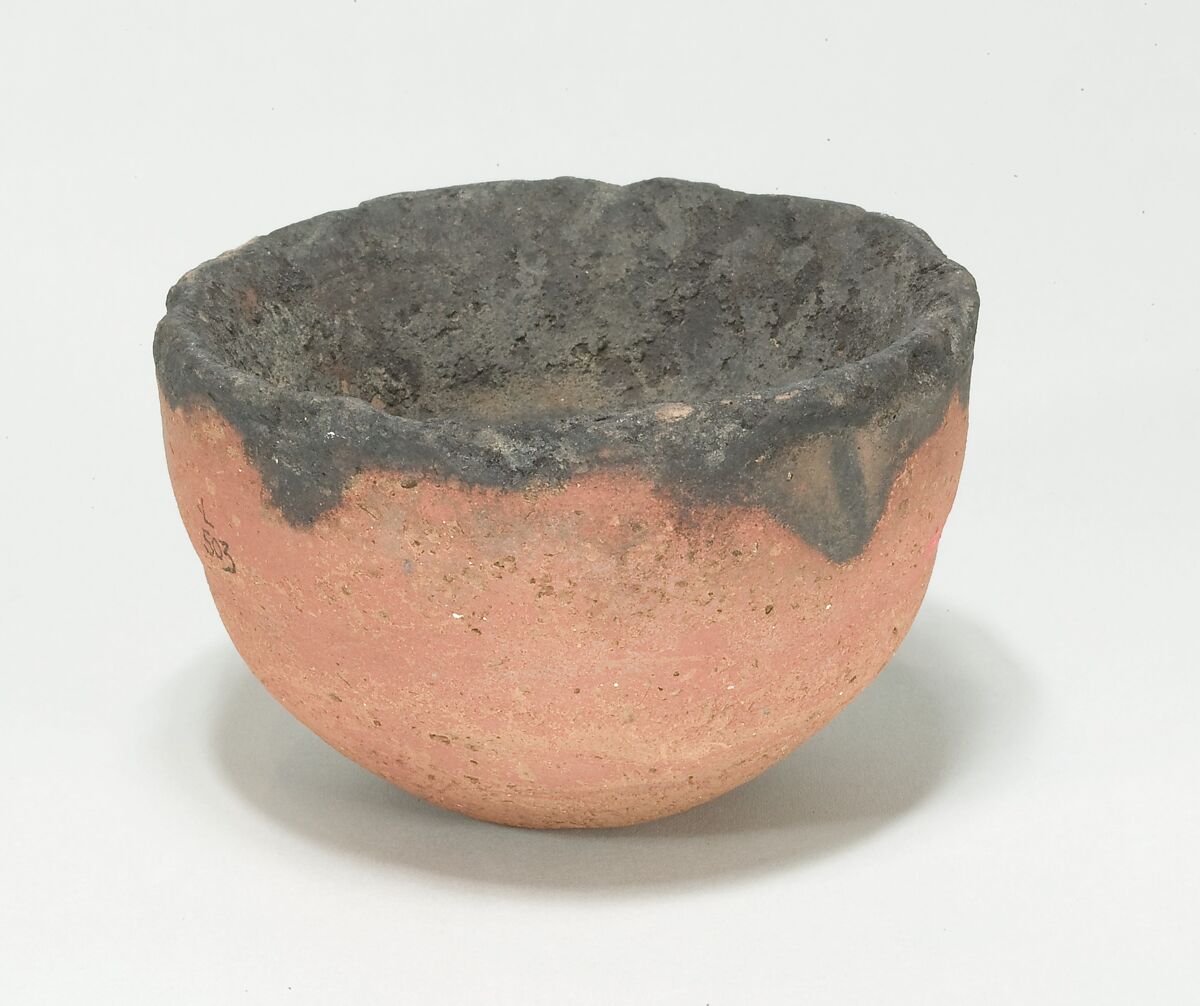 Lamp, Coarse red pottery with hematite wash 
