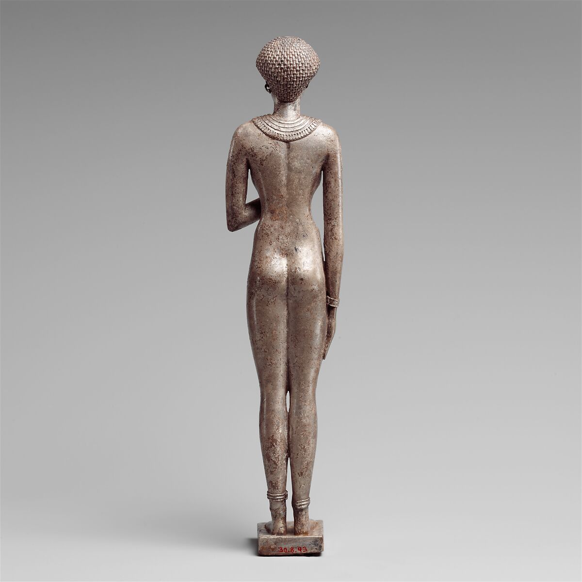 Statuette of a Royal (?)  Woman with the Cartouches of Necho II on her Arms, Silver