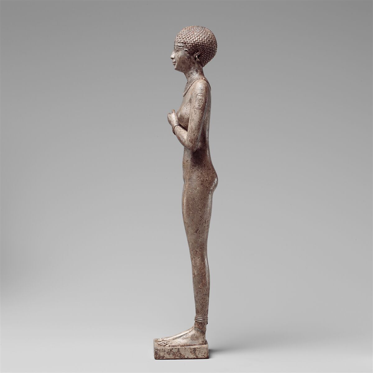 Statuette of a Royal (?)  Woman with the Cartouches of Necho II on her Arms, Silver