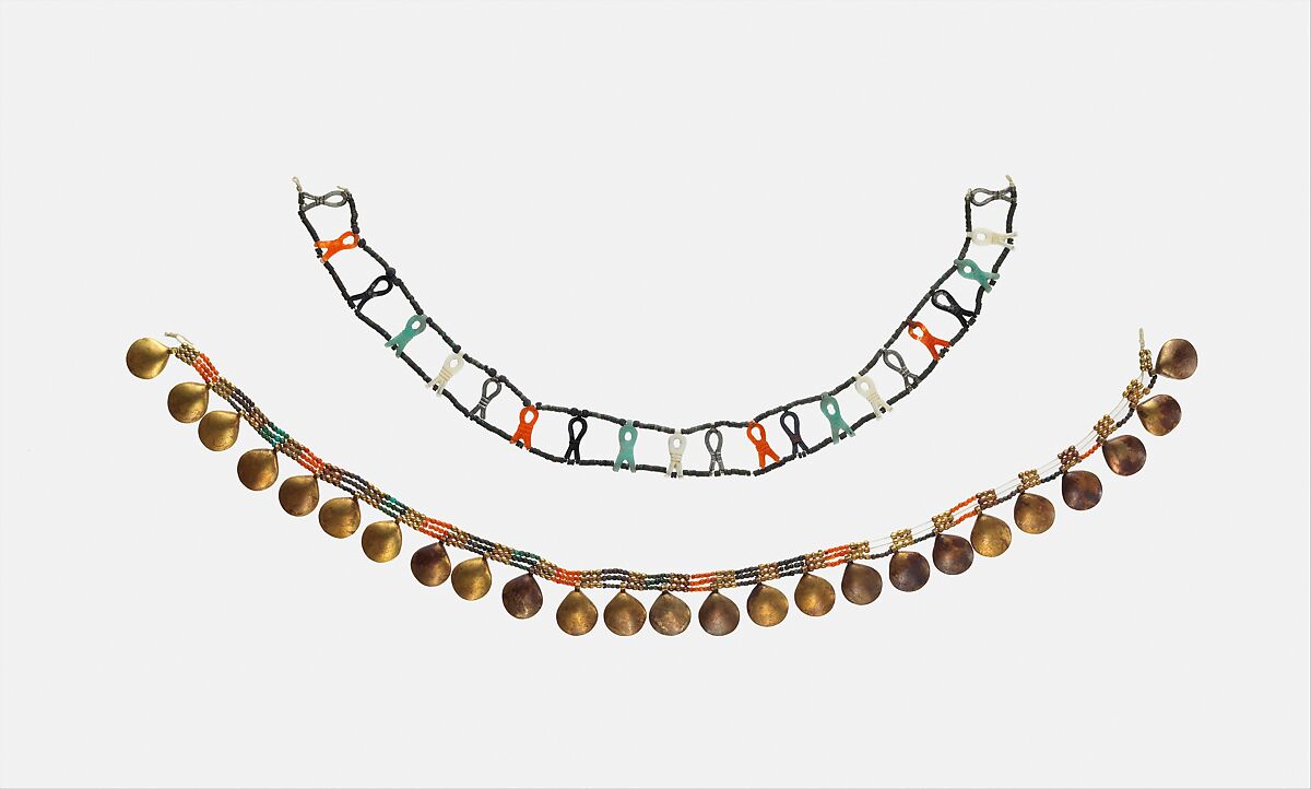 Necklace with Sa-Amulets of Senebtisi, Sa-amulets: Silver (5 originals, 4 restored), carnelian, feldspar, turquoise, ivory (4 restored). Tiny disk beads: top row turquoise, bottom row restored
Ball beads: silver