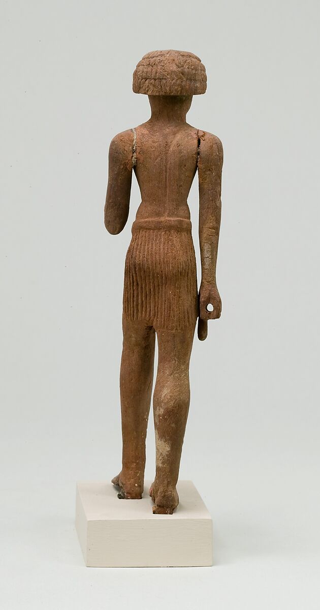 Statuette, striding man, Wood