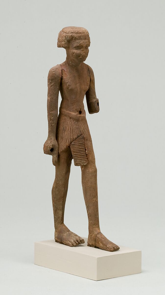 Statuette, striding man, Wood