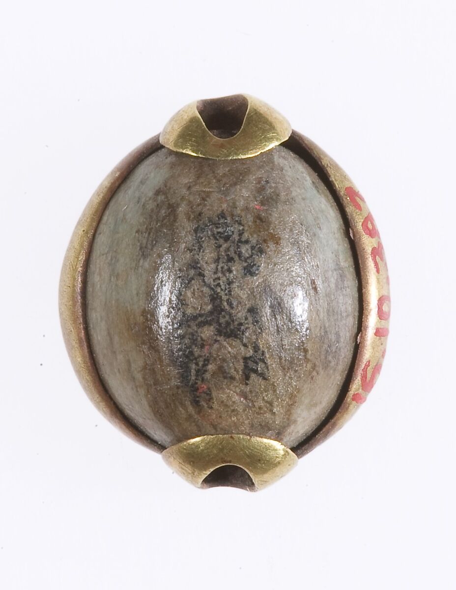 Cowroid Bead Set in a Ring Bezel, Steatite (glazed), gold