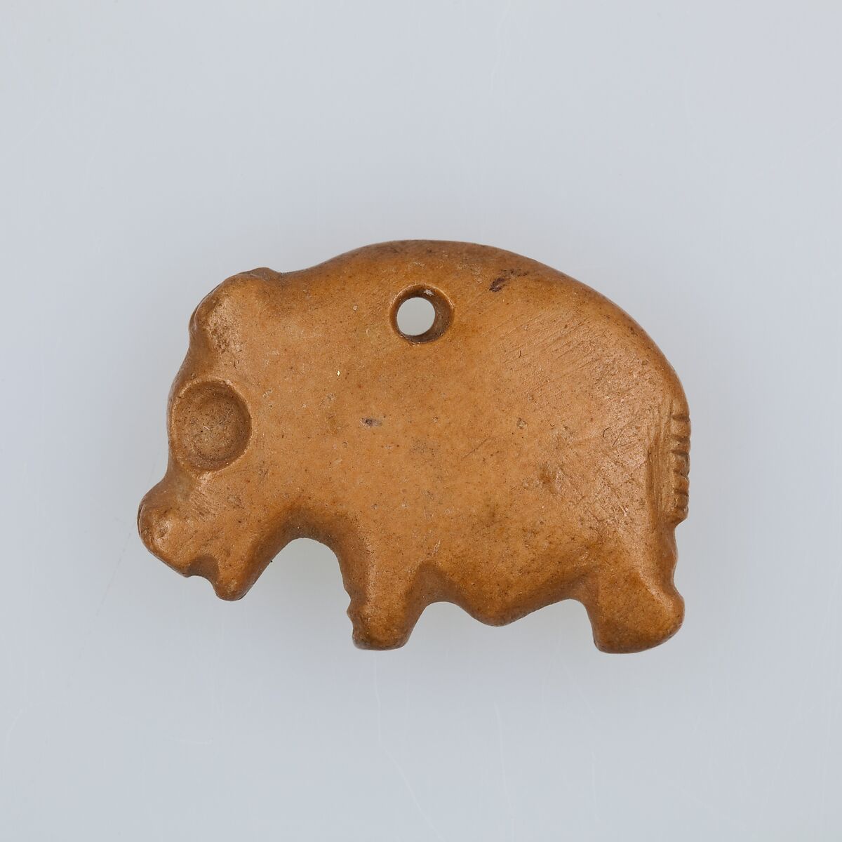 Amulet in the form of a hippo, Limestone (pink) 