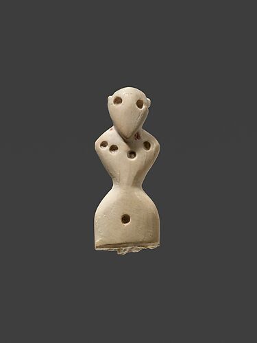 Female figurine wearing necklace