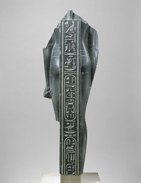 Torso of a Ptolemaic King, inscribed with cartouches of a late Ptolemy, Basalt