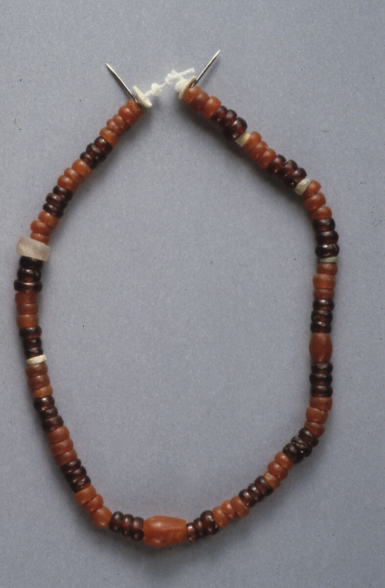 String of beads, Carnelian, garnet, quartz, glazed steatite 