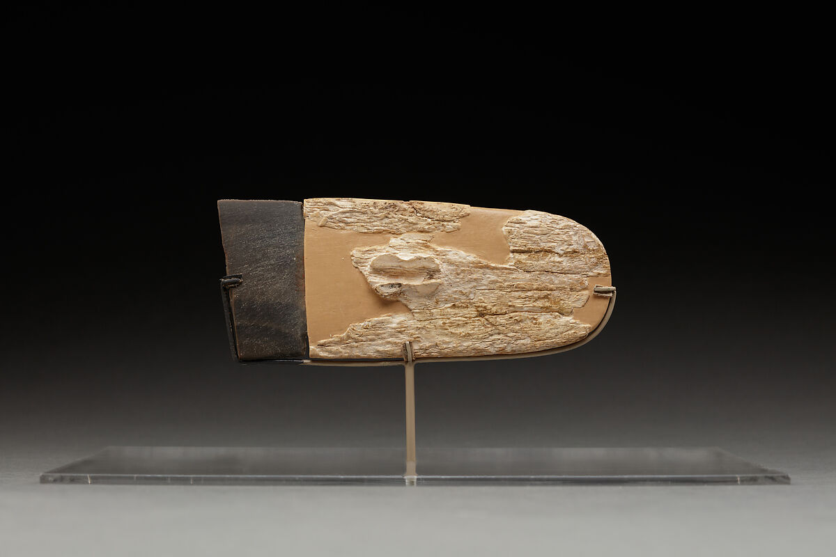 Carved handle of a ceremonial knife with part of the ripple-flaked knife, Ivory, flint 