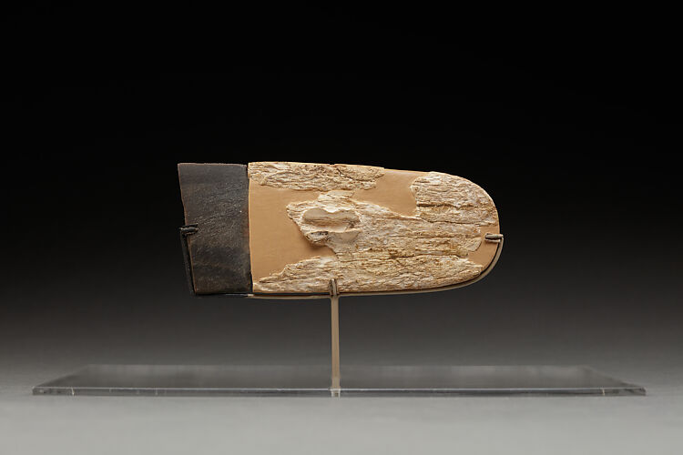 Carved handle of a ceremonial knife with part of the ripple-flaked knife