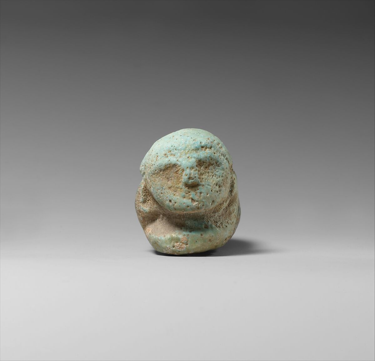 Figure of a Crouched Man, Faience