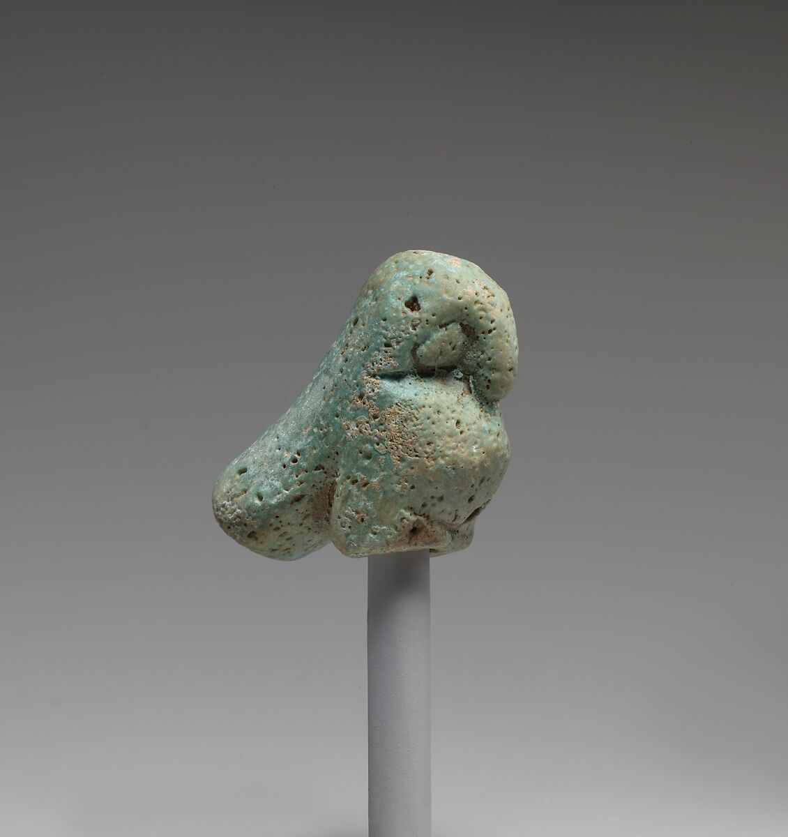 Figurine of a crouching falcon, Faience 