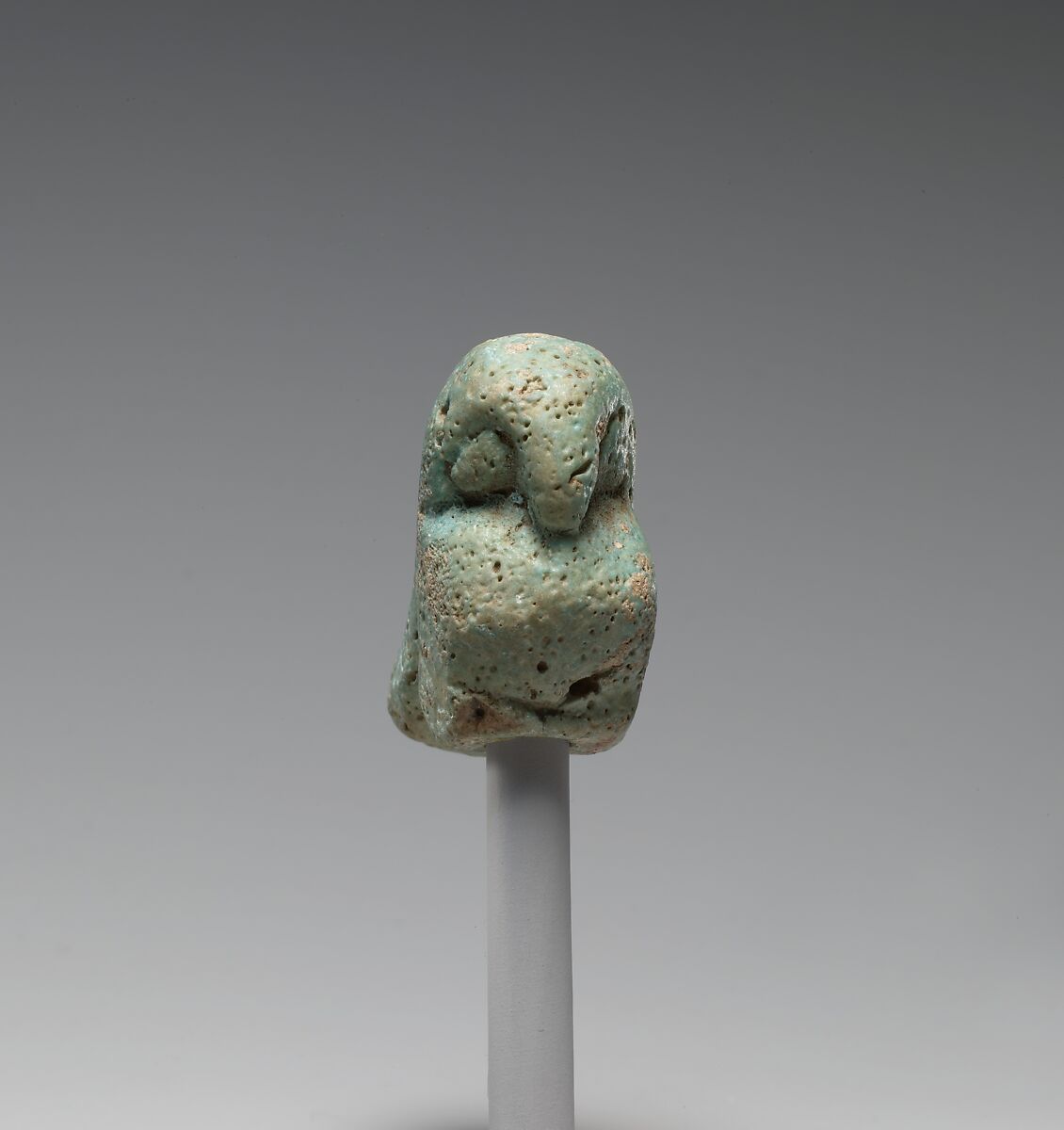 Figurine of a crouching falcon, Faience