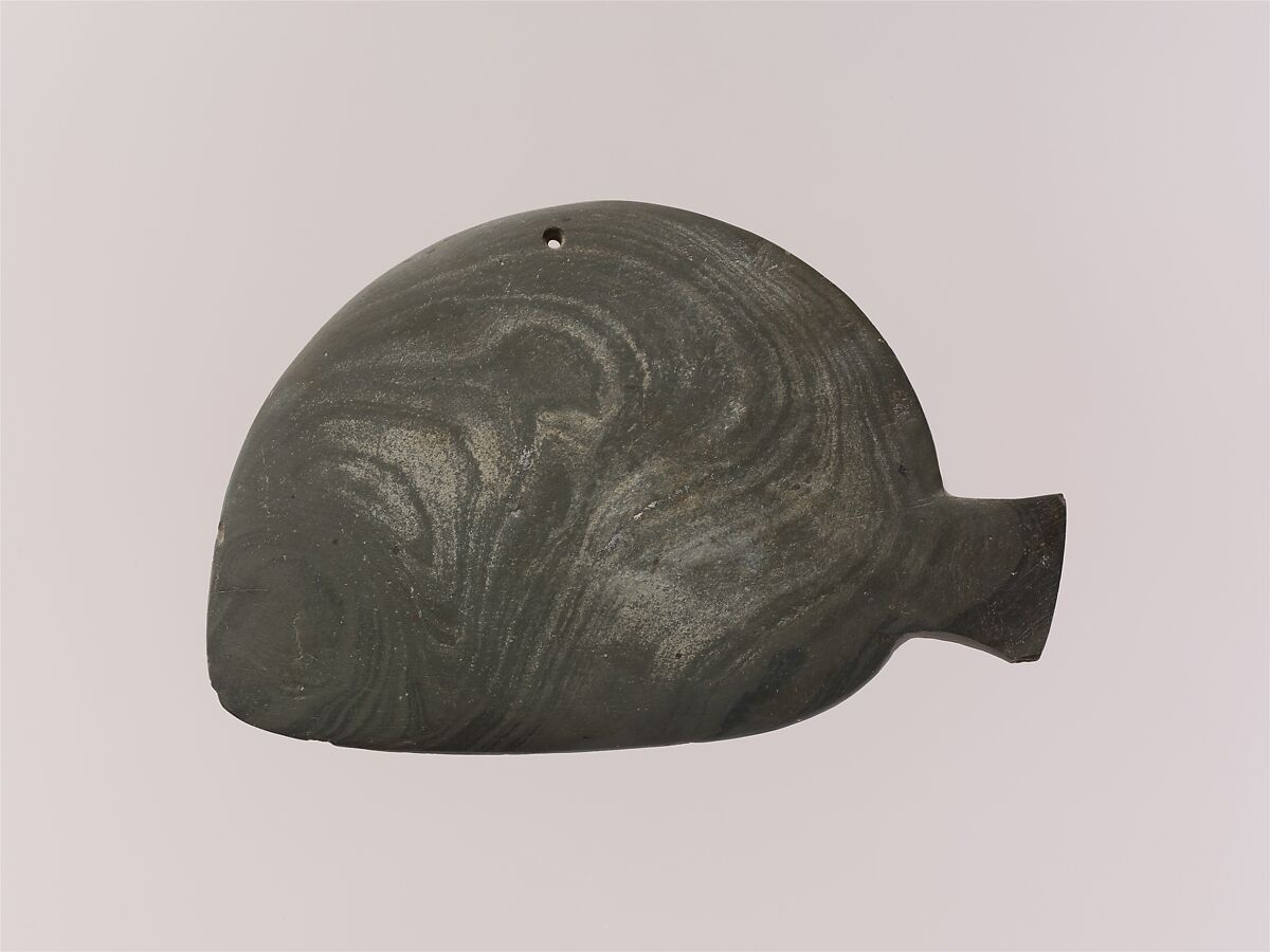 Fish-shaped palette with the remains of green pigment, Greywacke