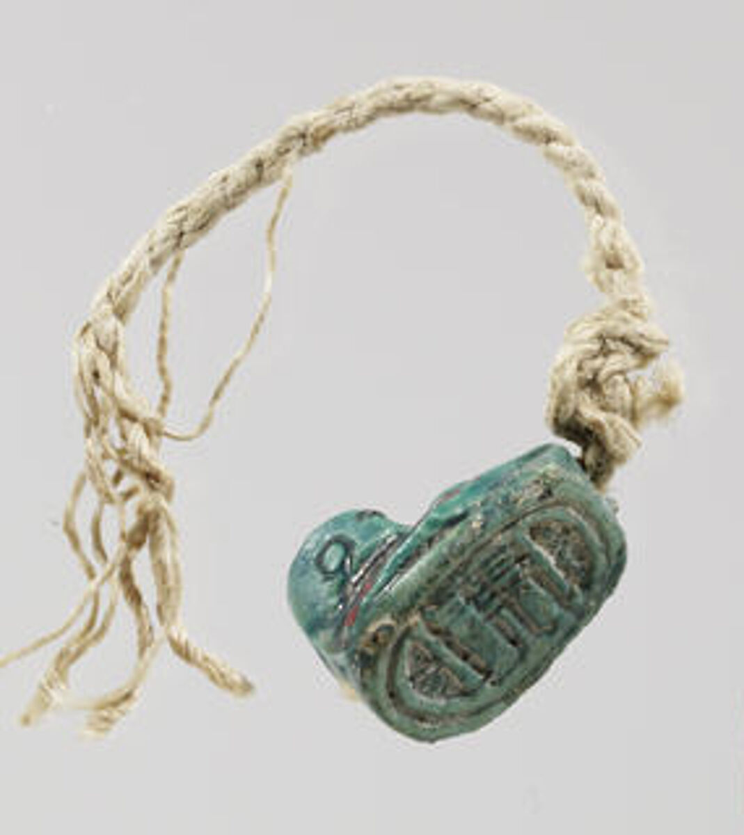 Duck Design-amulet, Glazed steatite, linen string