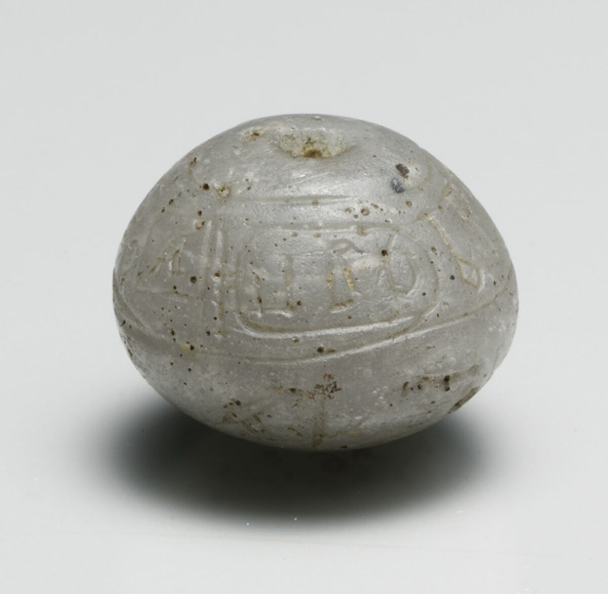 Ball Bead with the Names of Hatshepsut and the Overseer of Work Senenmut, Glass
