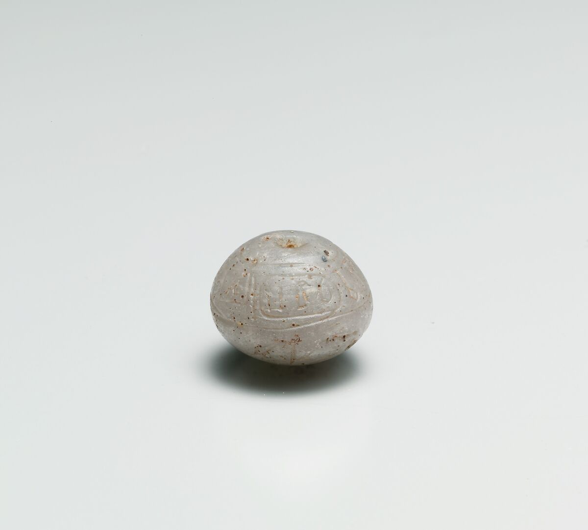 Ball Bead with the Names of Hatshepsut and the Overseer of Work Senenmut, Glass