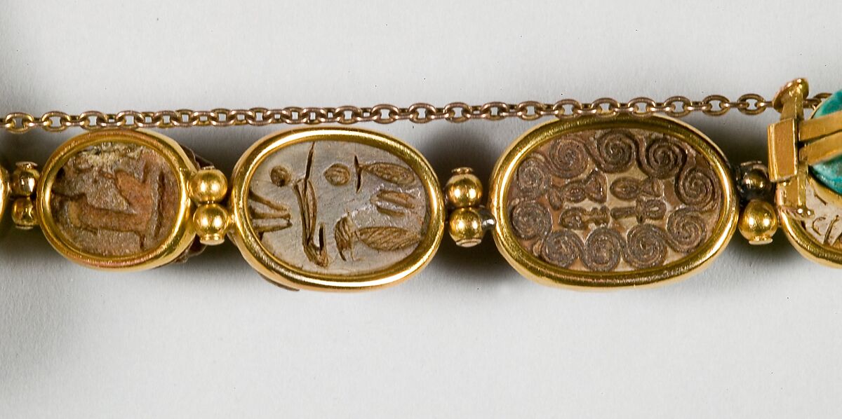 Nine scarabs set in modern bracelet., Glazed steatite, gold
