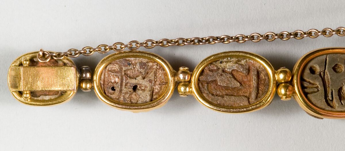 Nine scarabs set in modern bracelet., Glazed steatite, gold