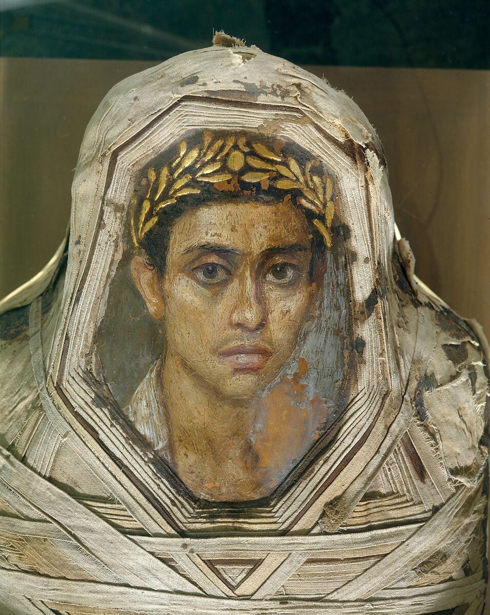 Mummy with an Inserted Panel Portrait of a Youth, Mummified human body with linen and mummification material; panel portrait: encaustic on limewood