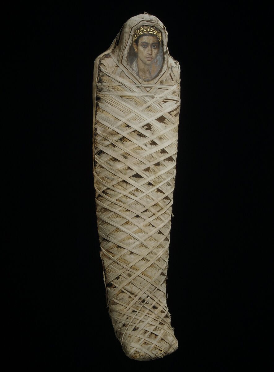 Mummy with an Inserted Panel Portrait of a Youth, Mummified human body with linen and mummification material; panel portrait: encaustic on limewood