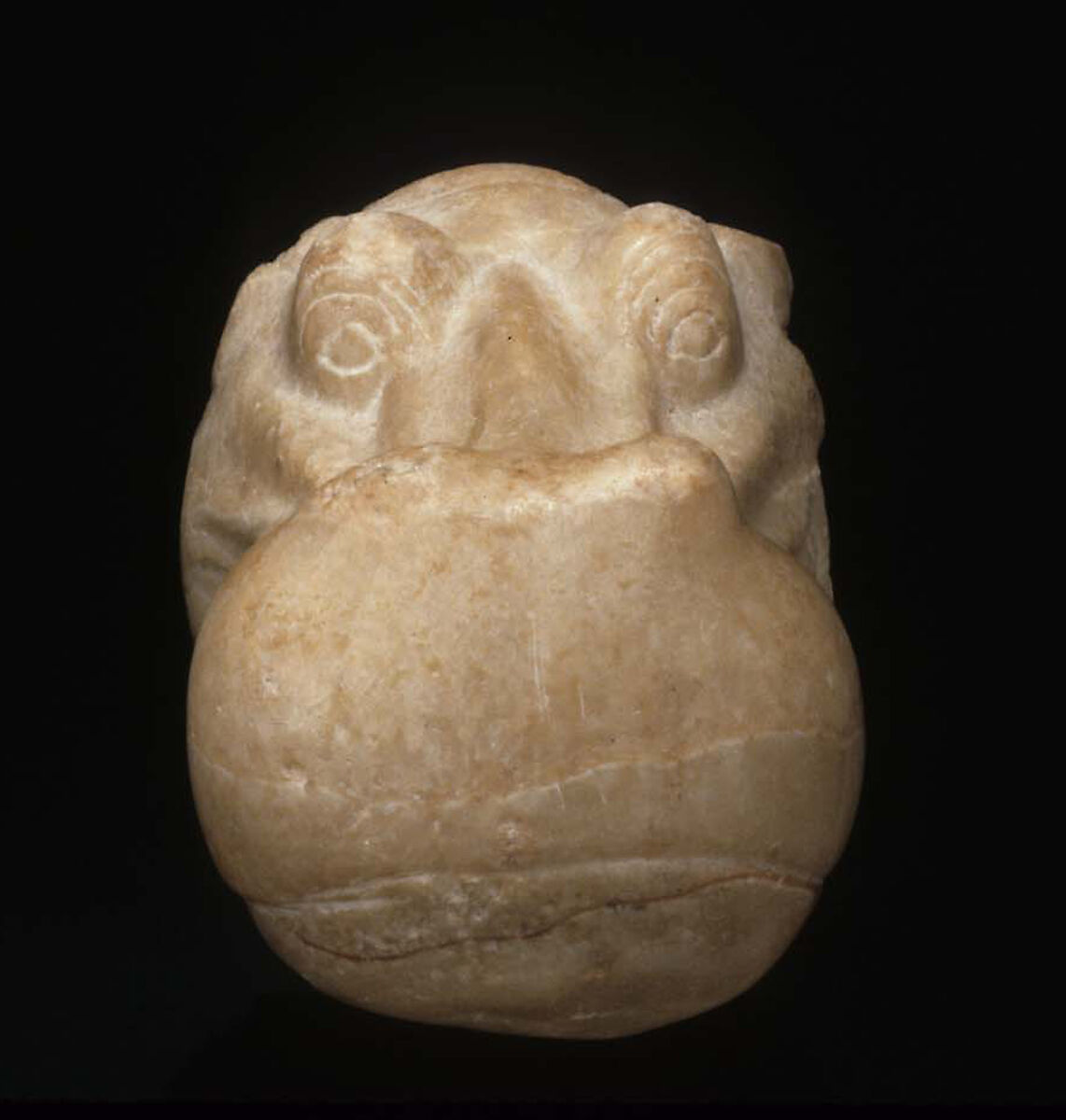 Head of a Hippopotamus, Travertine (Egyptian alabaster) with traces of gesso and red pigment