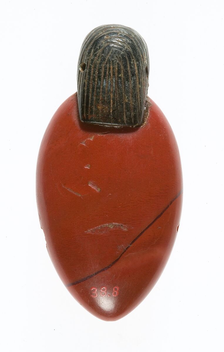 Heart amulet with human head, Jasper, carnelian, chlorite