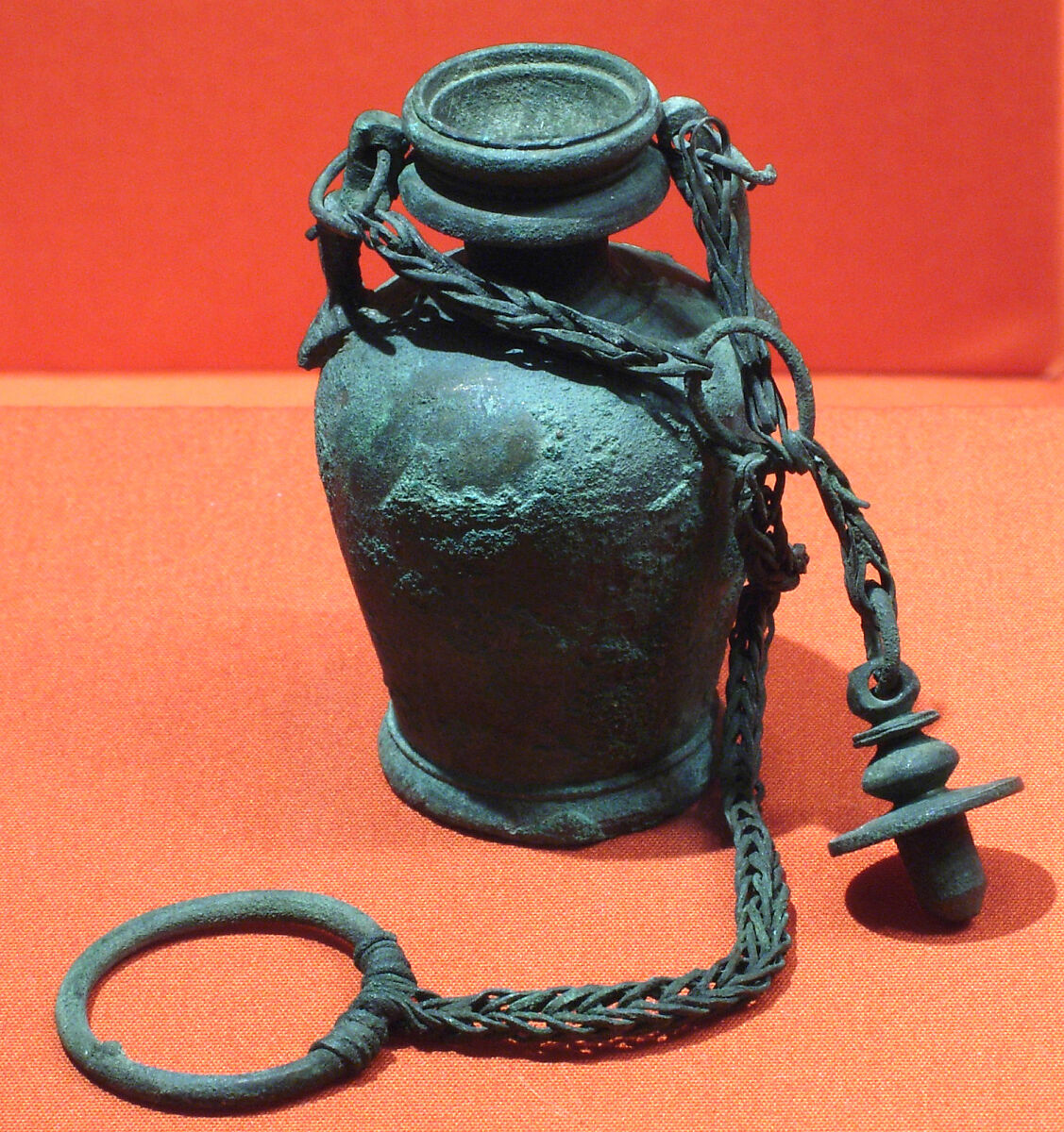 Bottle with stopper and suspension ring, possibly intended for unguent, Bronze or copper alloy 
